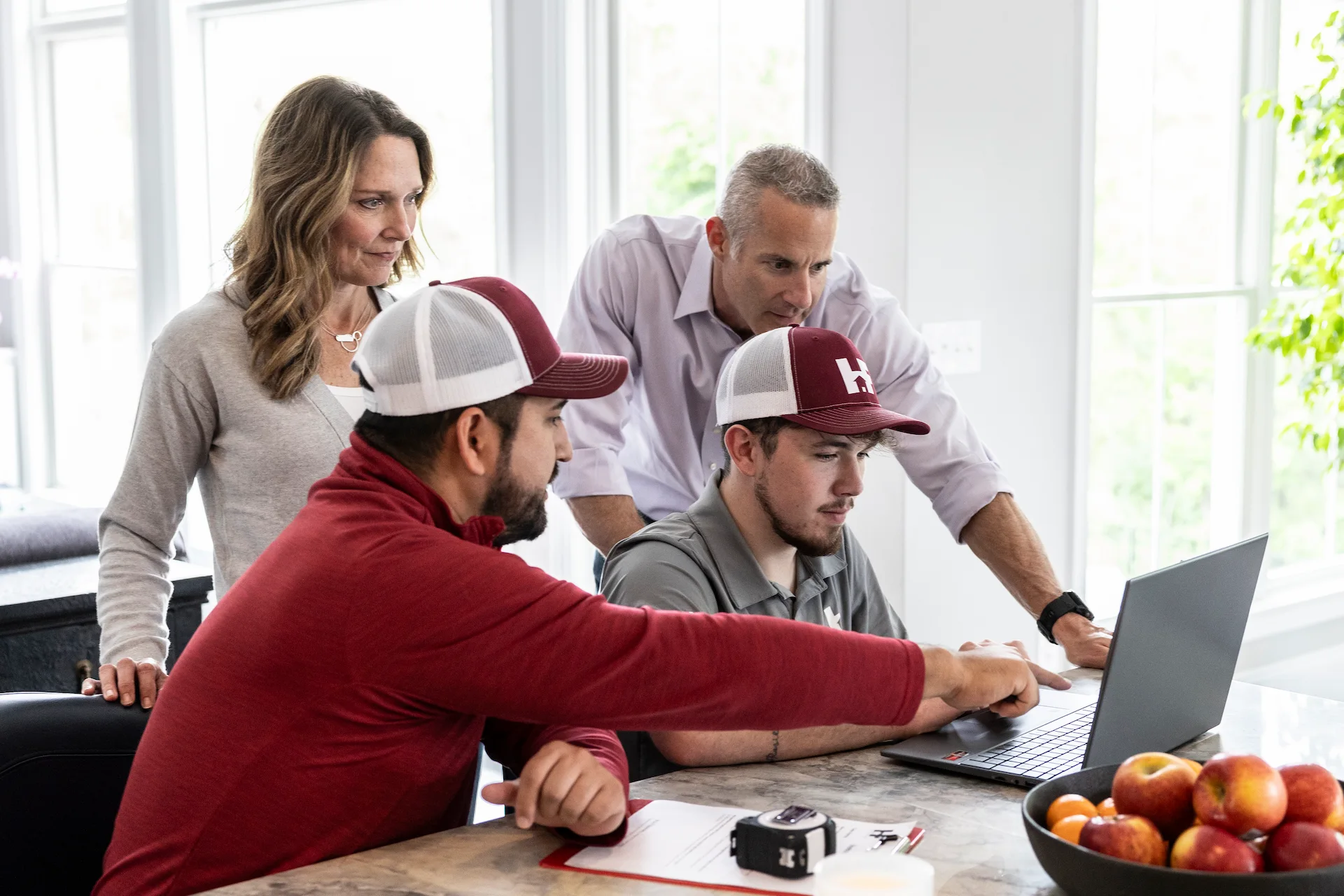 h&f employees working on a laptop