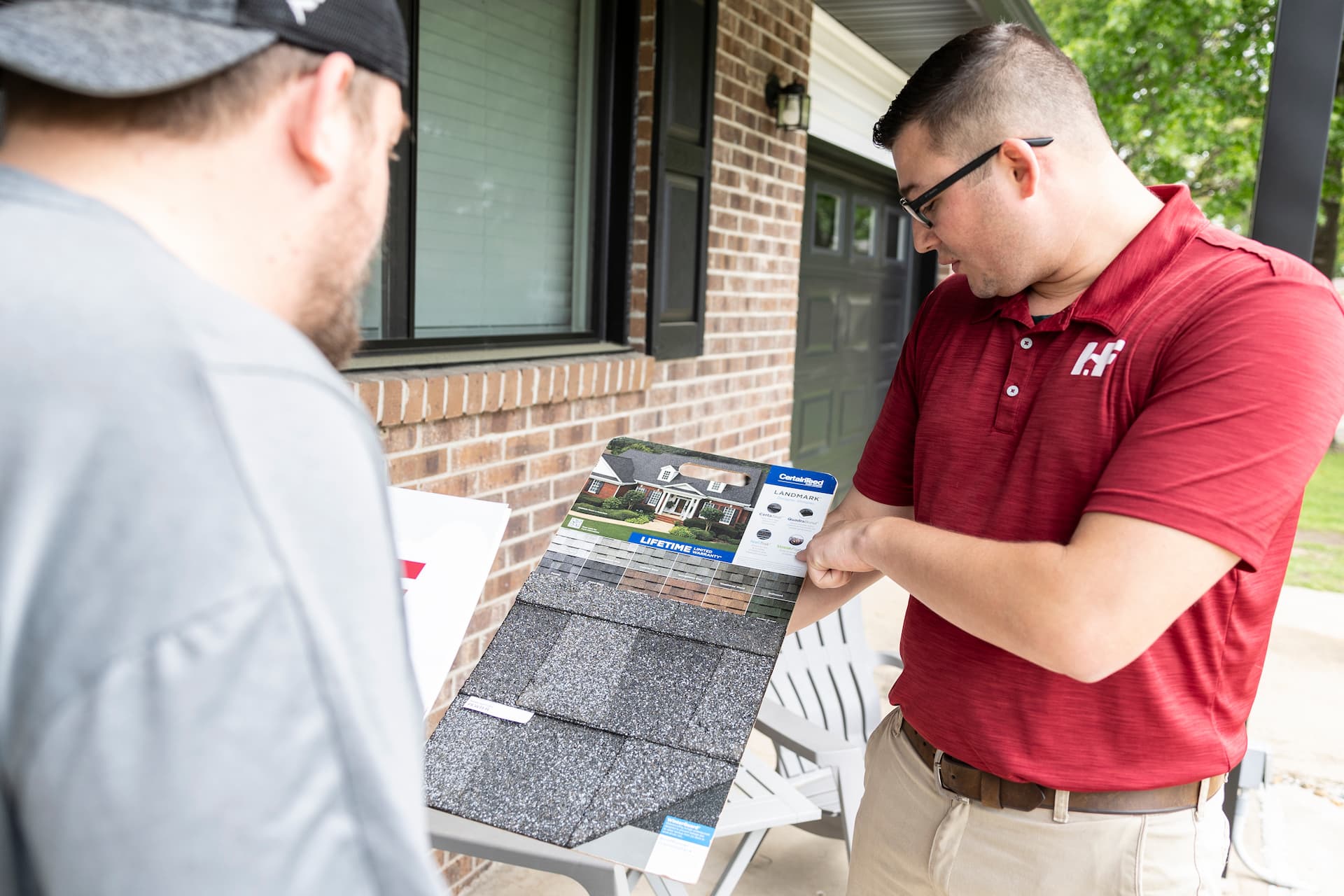 h&f team member showing a client their work