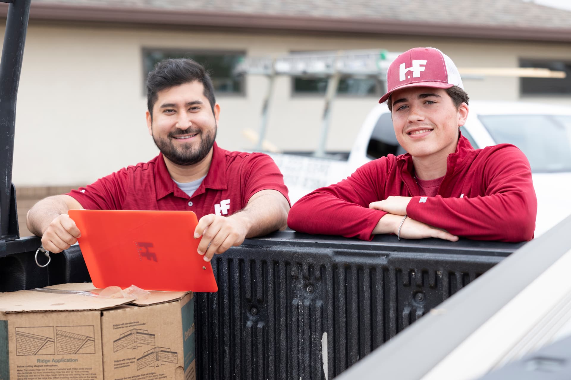 two h&f staff members smiling