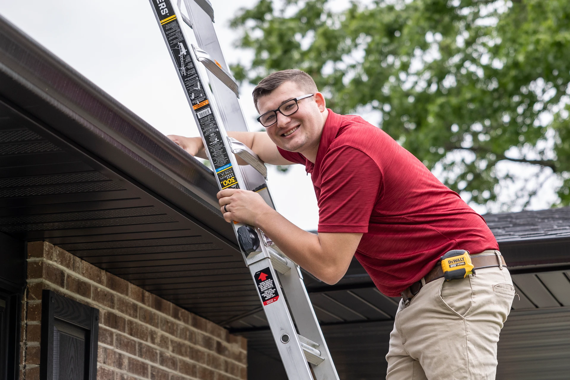 employee up a ladder